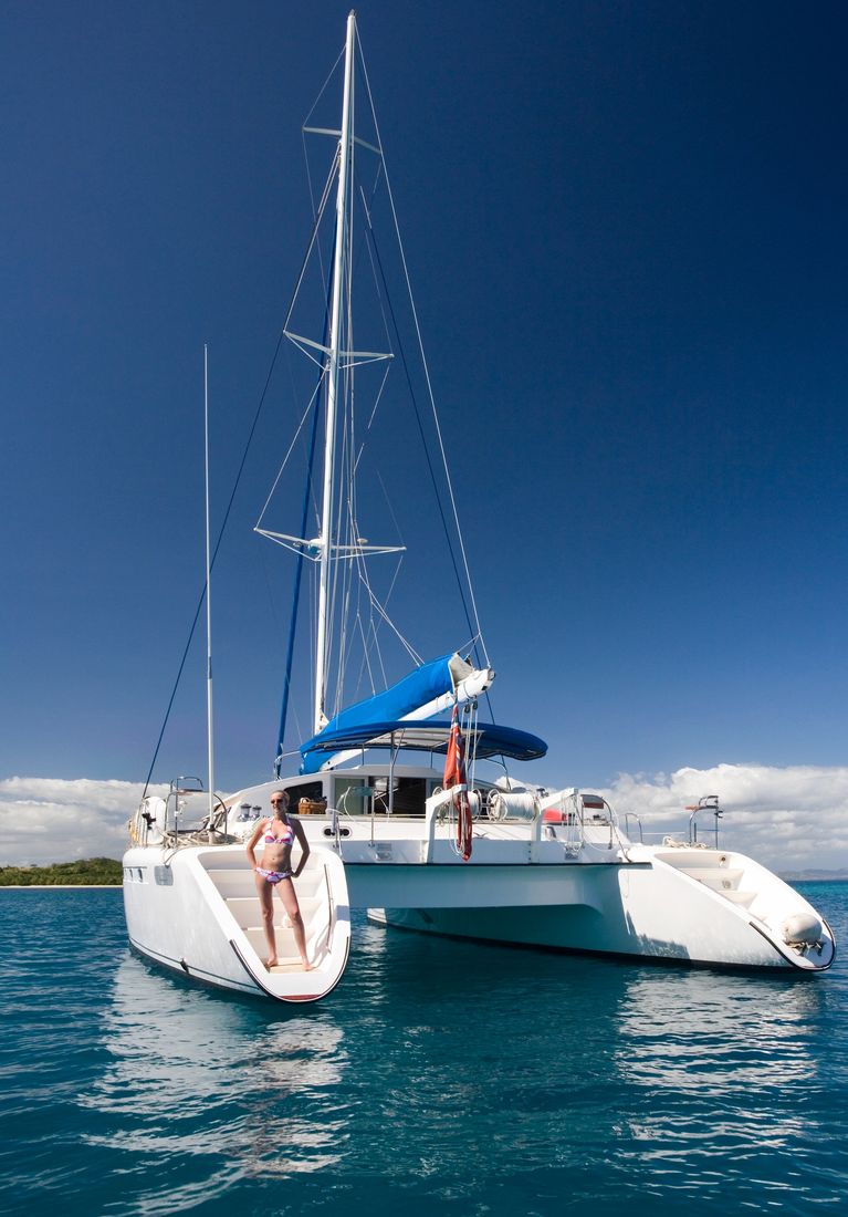 A catamaran anchored in turquoise water