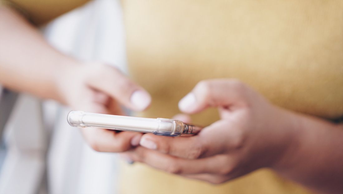 Hands holding a phone